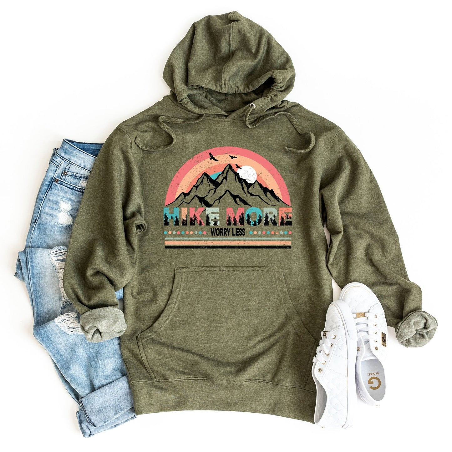 a green hoodie with a mountain scene on it