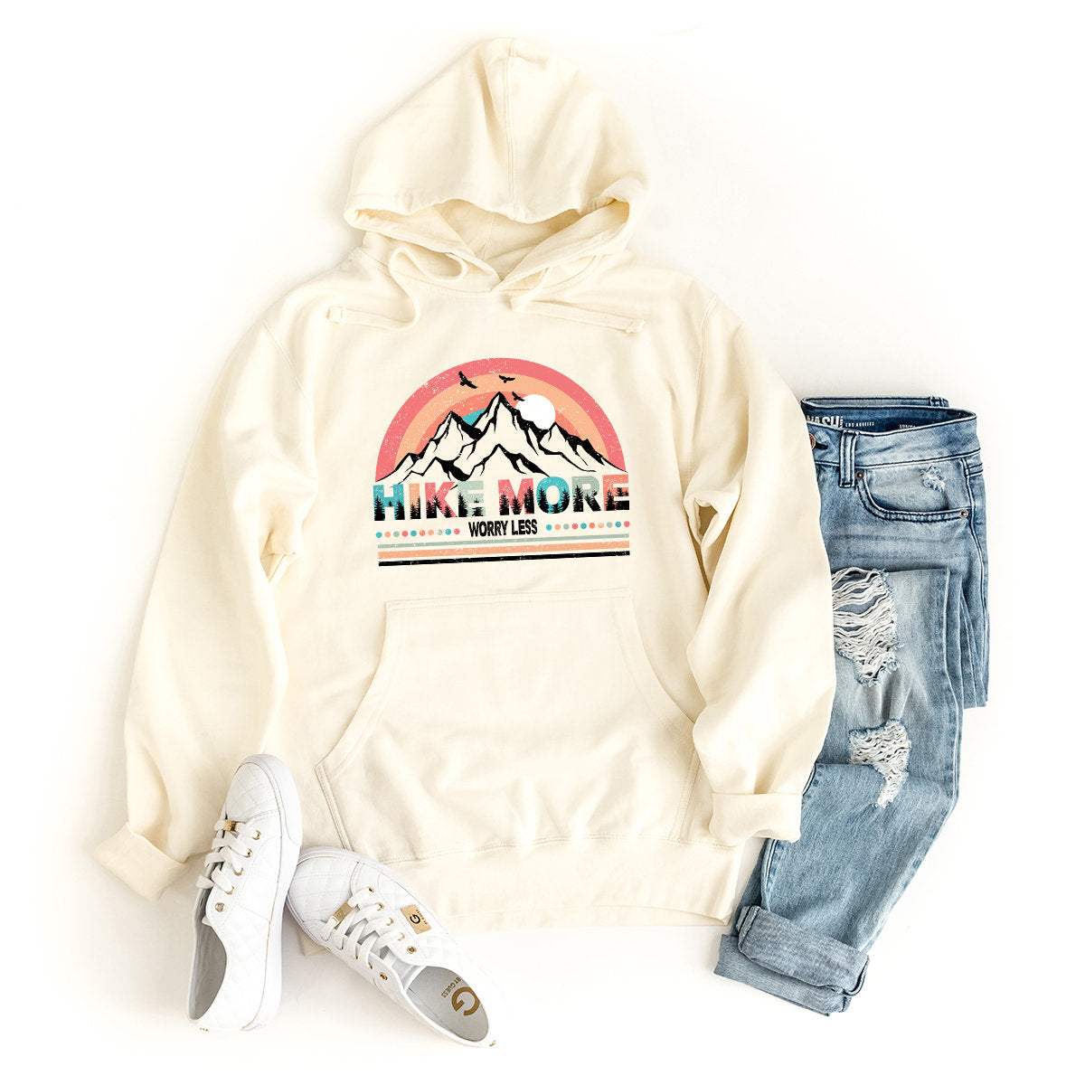 a white sweatshirt with a mountain scene on it